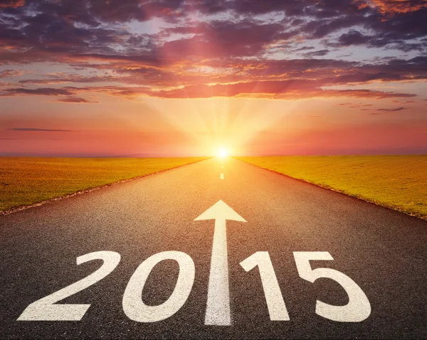 Driving on an empty road to 2015 — Stock Photo, Image