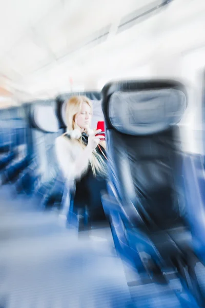 Girl travelling in First Class of train — Stock Photo, Image