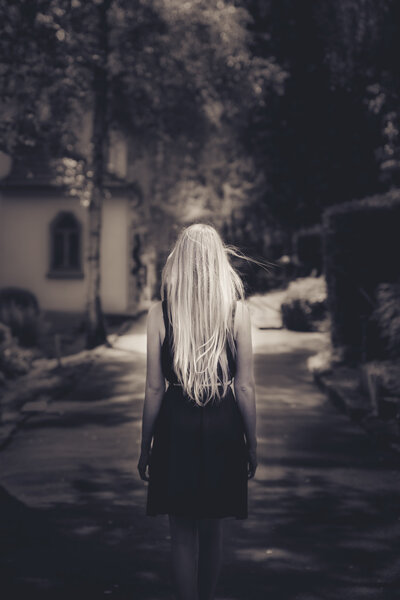 girl walking at cemetery
