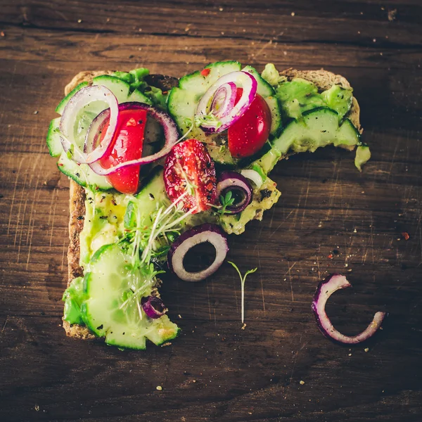 Vegan sandwich missing one bite — Stock Photo, Image