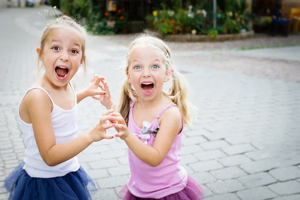 Cheeky liitle sisters — Stock Photo, Image