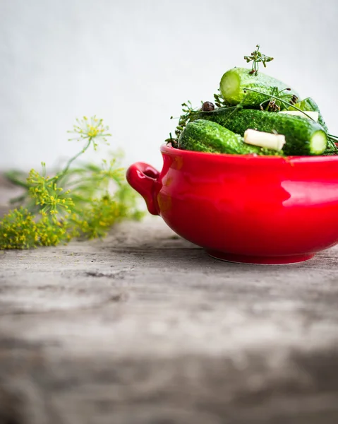 Cucumbers in a red bowl — Stock Photo, Image