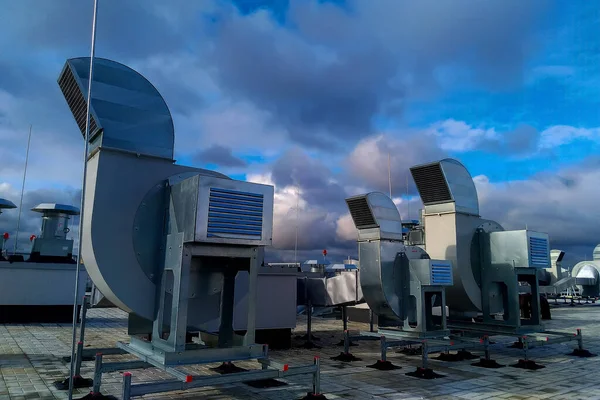 Ventilation and air conditioning system on the roof of an office building. System made of galvanized steel pipes.