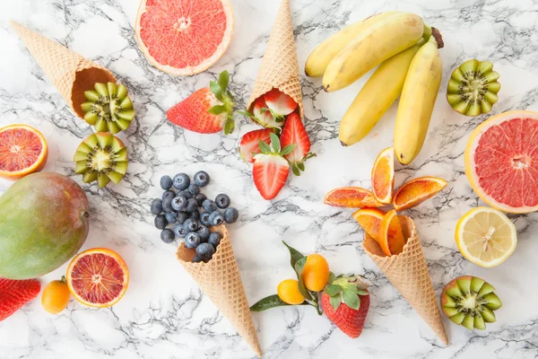 Ice cream cones with fresh fruits — Stock Photo, Image