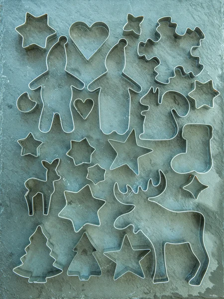 Christmas background with cookie cutters — Stock Photo, Image