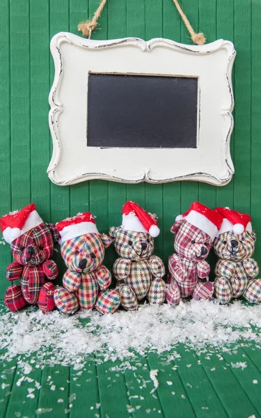 Trochę teddybears z Santa kapelusze — Zdjęcie stockowe