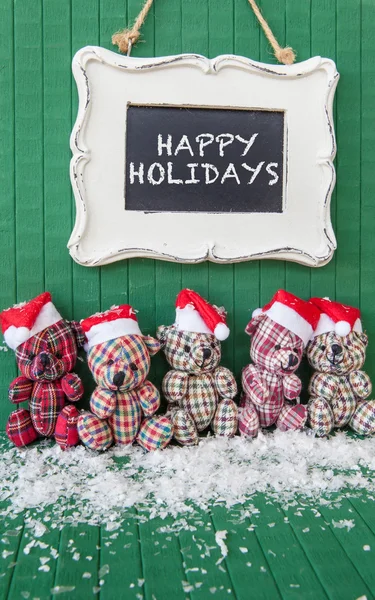 Little teddybears with Santa hats — Stock Photo, Image