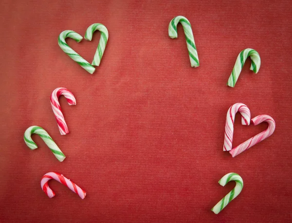 Candy canes on red — Stock Photo, Image