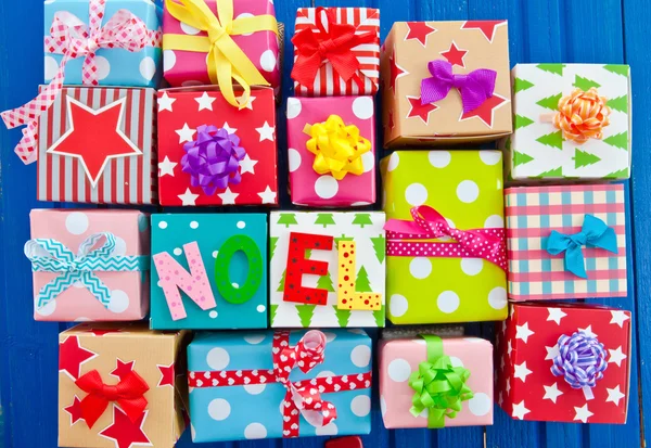 Little presents wrapped in colorful paper — Stock Photo, Image