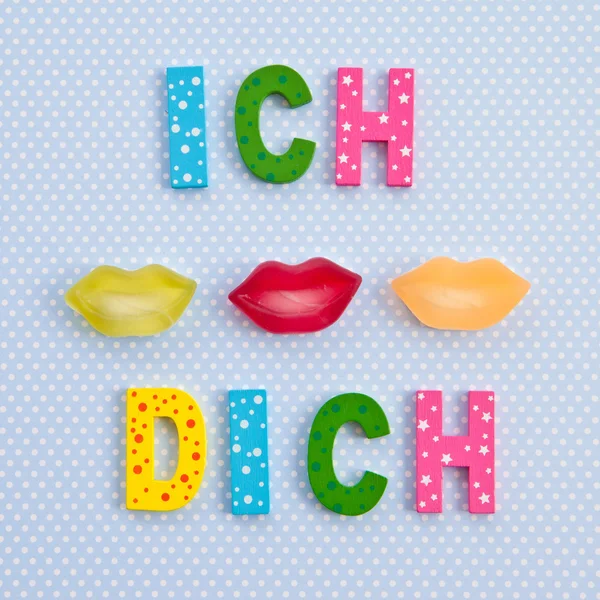 I Kiss you in German with lip shaped candy — Stock Photo, Image