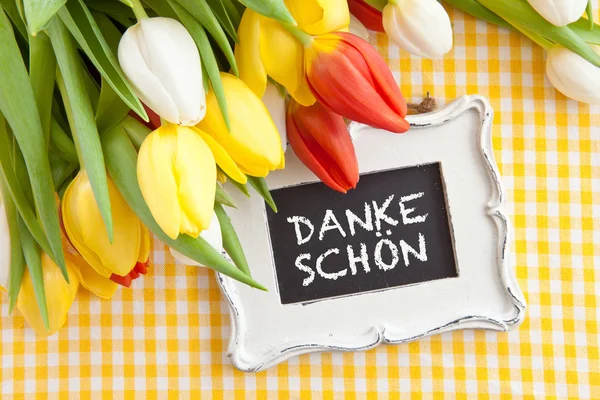 Fresh tulips and a vintage chalkboard — Stock Photo, Image