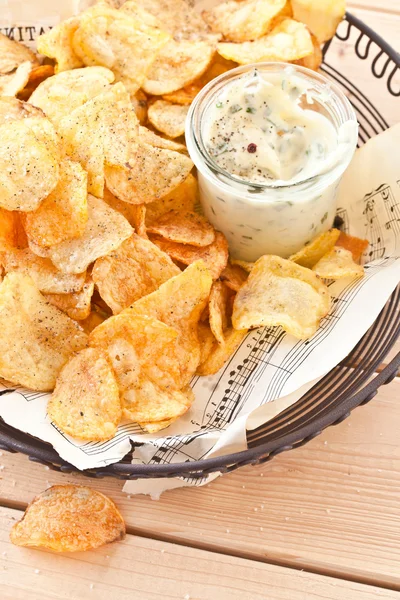 Vintage mesh basket with chips — Stock Photo, Image