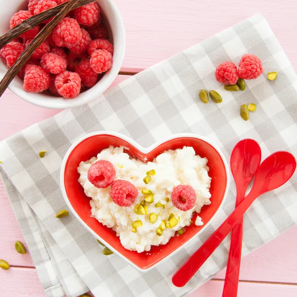 Rice pudding with raspberries — Stock Photo, Image