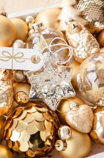 Variety of golden christmas ornaments — Stock Photo, Image