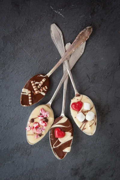 Spoons with chocolate — Stock Photo, Image