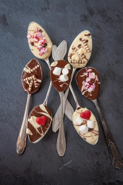 Spoons with chocolate — Stock Photo, Image