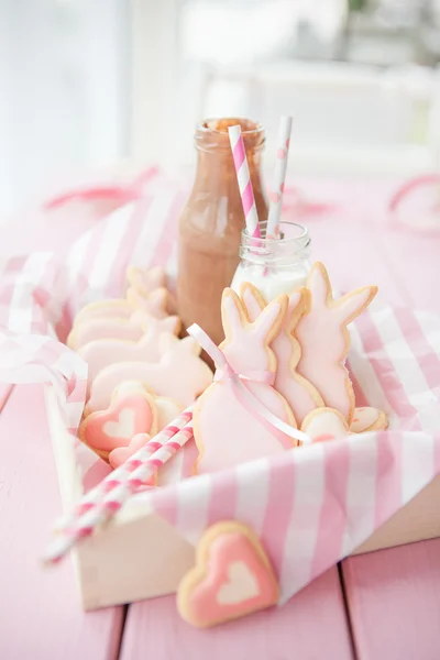 Pink cookies and milk — Stock Photo, Image