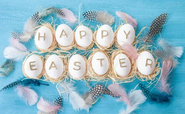 Chicken eggs with easter greeting — Stock Photo, Image