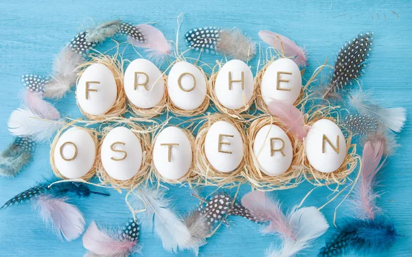 Chicken eggs with easter greeting — Stock Photo, Image