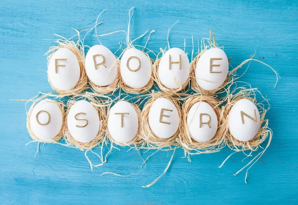 Chicken eggs with easter greeting — Stock Photo, Image