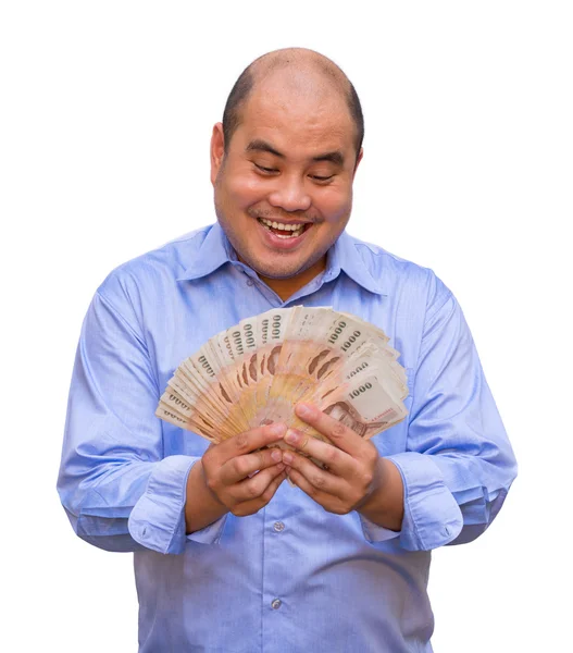 Um empresário gordo e careca do escritório está a segurar um monte de notas tailandesas com a cara gananciosa a suar. É um momento de riqueza e riqueza. . — Fotografia de Stock