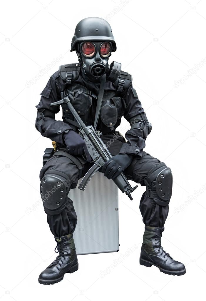 Special force soldier wearing military uniform with sub machine gun weapon gas mask is sitting in white isolated isolation background
