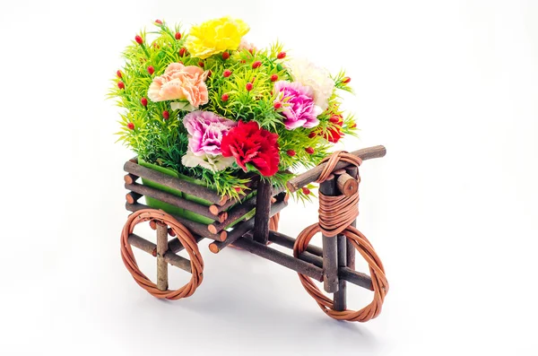 Flores artificiales en un carrito Imagen De Stock