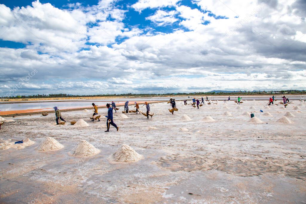 Phetchaburi Salt flats Naklua, farms and farmers collecting salt in Phetchaburi, Thailand