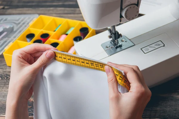 Beautiful young woman tailor measuring — Stock Photo, Image