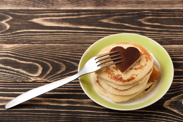 Stack of pancakes on wooden board — Stock Photo, Image