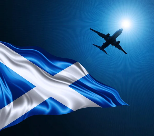 Scotland flag of silk at night with an airplane on the sky background. 3D illustration