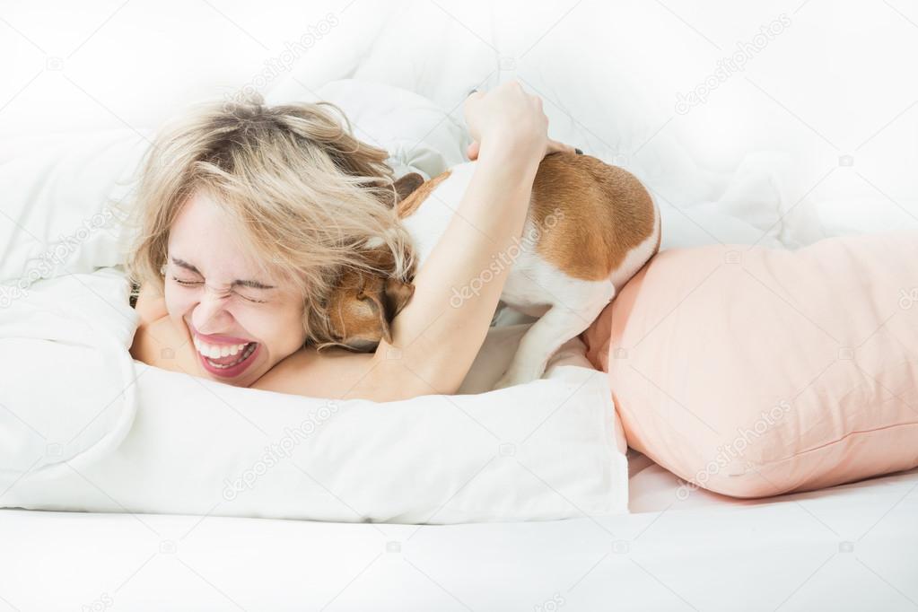 happy woman and the dog playing