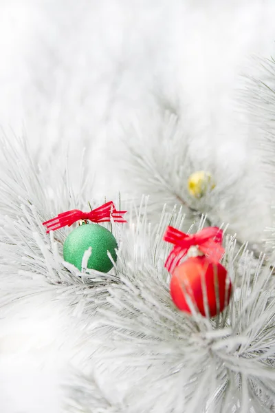 Christmas decorations on a tree in frost — Stock Photo, Image