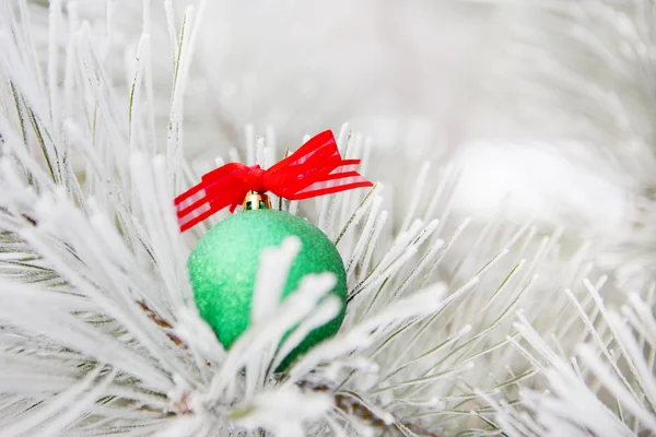 Christmas decorations on a tree in frost — Stock Photo, Image