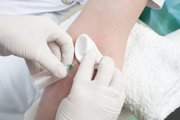 Taking a blood sample from the patient's arm. — Stock Photo, Image