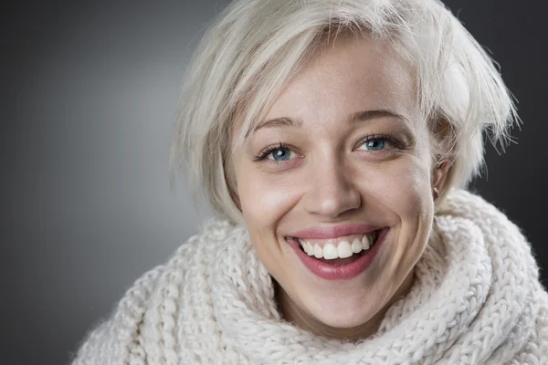 Attractive blond woman smiling charmingly — Stock Photo, Image