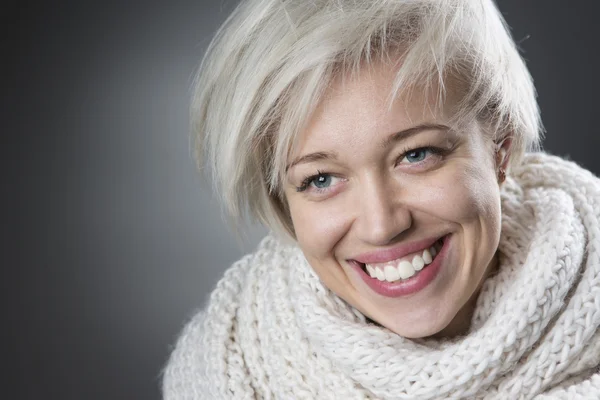 Attractive blond woman smiling charmingly — Stock Photo, Image