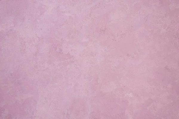 Pembe duvar arka planı. Pembe boyanmış beton duvar dokusu.