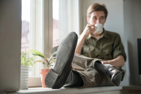 Romantic pensive man with cup of coffee — Stock Photo, Image
