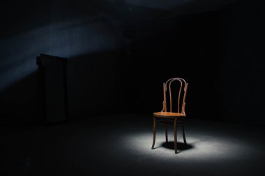 Lonely chair at the empty room clipart