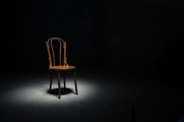Lonely chair at the empty room clipart