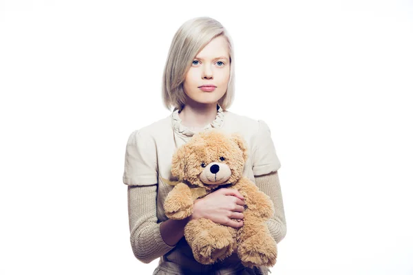 Young blonde woman with teddy bear — Stock Photo, Image