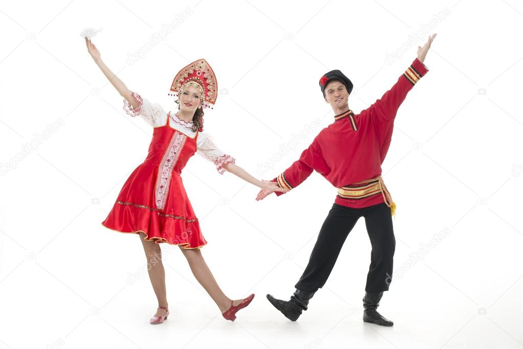 Dancing couple russian national costumes hold hands in dance pose