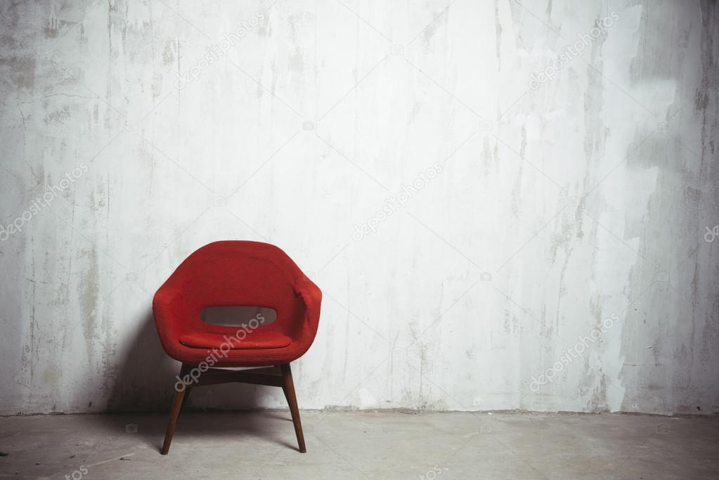 red armchair near the wall