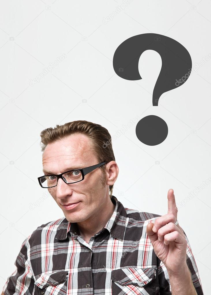 Handsome man in eyeglasses and tartan shirt put his index finger up to show for question mark. 