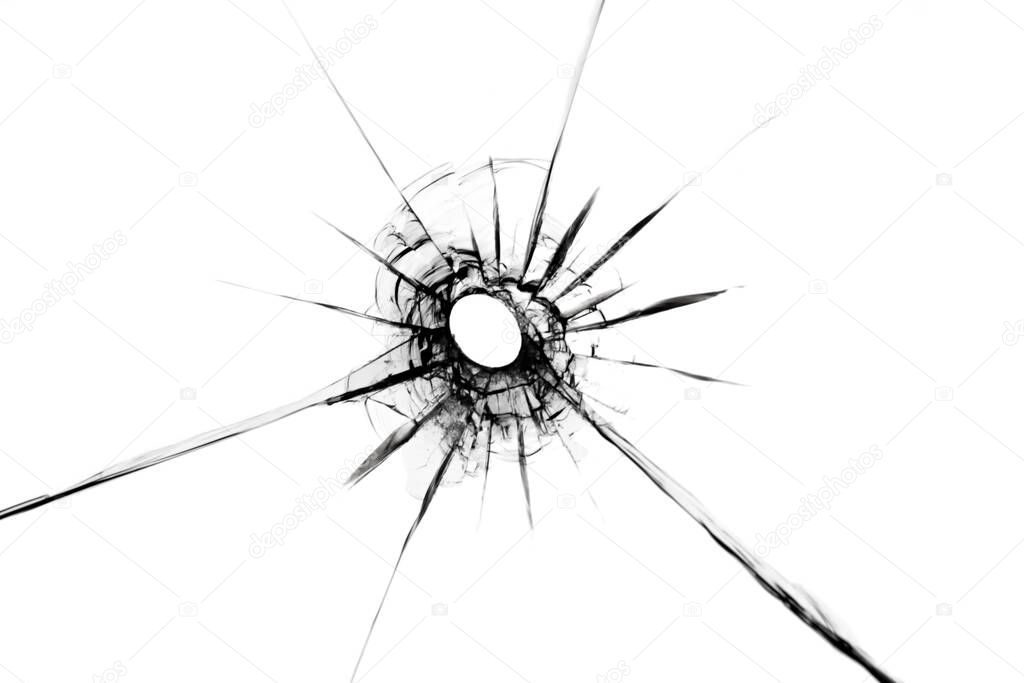Broken glass texture with hole in center isolated on white background. The effect of cracks on the window