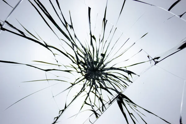 ガラスへの衝撃によるガラスの割れパターン チップや線の抽象化 — ストック写真