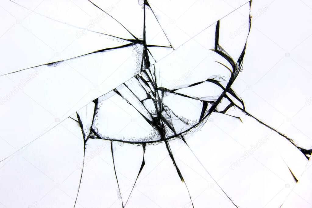 Broken glass texture on a white background. The protective glass of the phone is cracked from boredom. Cracks on damaged transparent material.