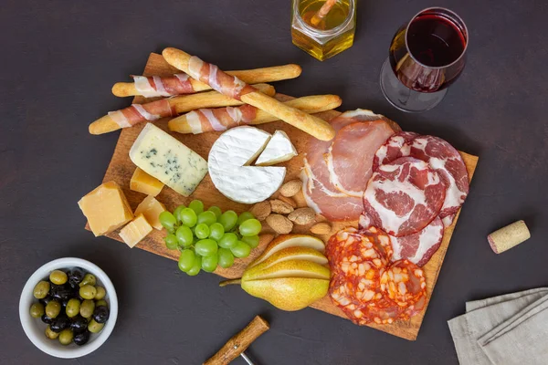 Wine snack. Jamon, camembert, chorizo, almonds blue cheese parmesan Antipasti Wine appetizer