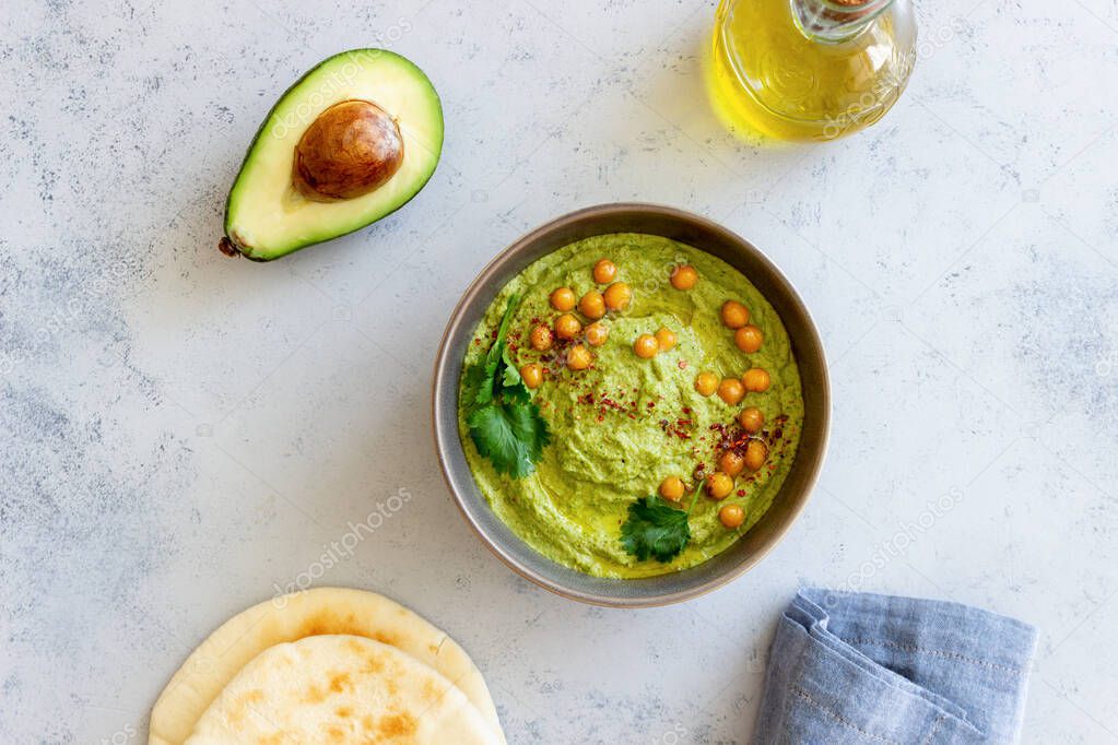 Avocado hummus in a gray bowl. Healthy eating. Vegetarian food